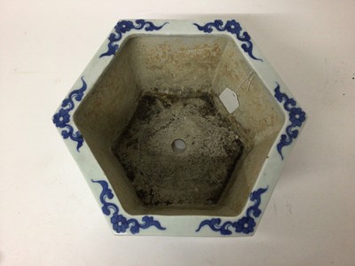 Lot 145 - A pair of 19th century Chinese blue and white porcelain jardinières, of hexagonal form, decorated with floral patterns, 17cm high x 27cm at widest point
