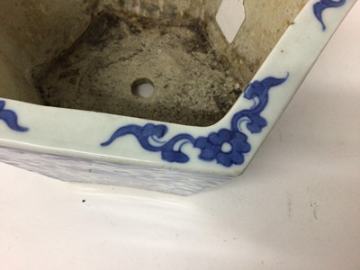 Lot 145 - A pair of 19th century Chinese blue and white porcelain jardinières, of hexagonal form, decorated with floral patterns, 17cm high x 27cm at widest point