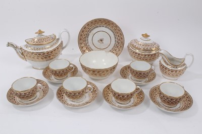 Lot 147 - A Chamberlain Worcester tea set, circa 1800, decorated in gilt and enamel with a foliate pattern, comprising a teapot, cream jug, sucrier, bowl, six cups, six saucers and a side dish