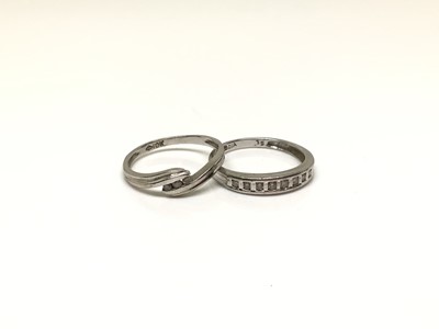 Lot 37 - 9ct white gold diamond half eternity ring and 10k white gold diamond three stone cross over ring (2)