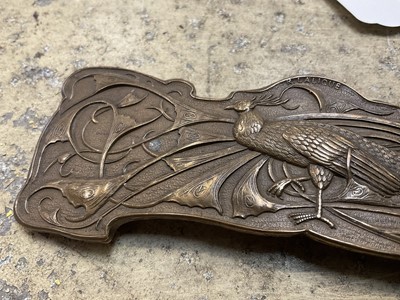 Lot 952 - R. Lalique gilt bronze buckle, relief decorated a stylised peacock, the reverse stamped, 'Tiffany New York