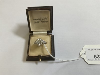 Lot 632 - Art Deco diamond single stone ring with a round old European cut diamond estimated to weigh approximately 2.5cts in eight claw setting flanked by six baguette cut diamonds to the stepped shoulders...