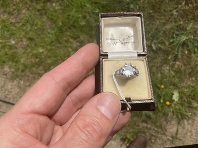 Lot 632 - Art Deco diamond single stone ring with a round old European cut diamond estimated to weigh approximately 2.5cts in eight claw setting flanked by six baguette cut diamonds to the stepped shoulders...