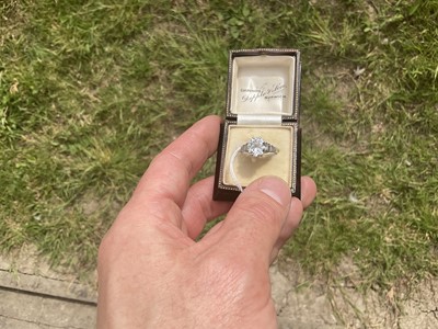 Lot 632 - Art Deco diamond single stone ring with a round old European cut diamond estimated to weigh approximately 2.5cts in eight claw setting flanked by six baguette cut diamonds to the stepped shoulders...