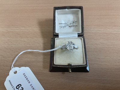 Lot 632 - Art Deco diamond single stone ring with a round old European cut diamond estimated to weigh approximately 2.5cts in eight claw setting flanked by six baguette cut diamonds to the stepped shoulders...