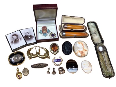 Lot 39 - Group of antique and later jewellery and bijouterie including two amber cheroots, one with gold mount, one with silver, cameo brooches, pair of gilt metal hoop earrings, fob seals, stick pins etc