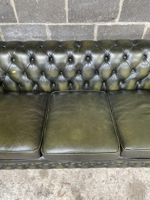Lot 27 - Green leather three -seater chesterfield settee