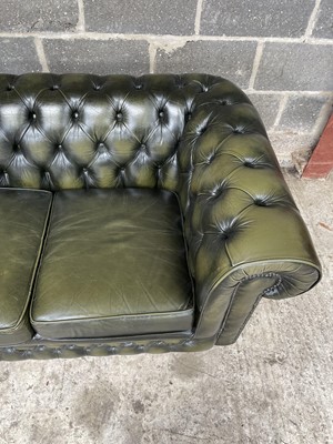 Lot 27 - Green leather three -seater chesterfield settee