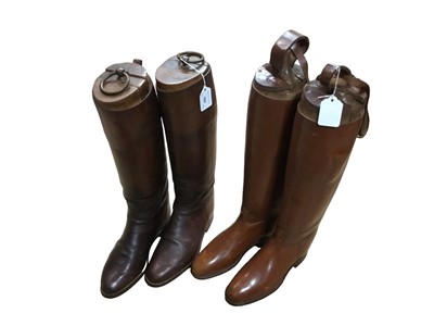 Lot 787 - Two pairs of brown leather riding boots, both with wooden trees