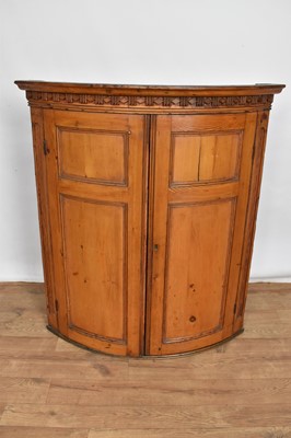 Lot 1408 - George III pine barrel form corner cupboard