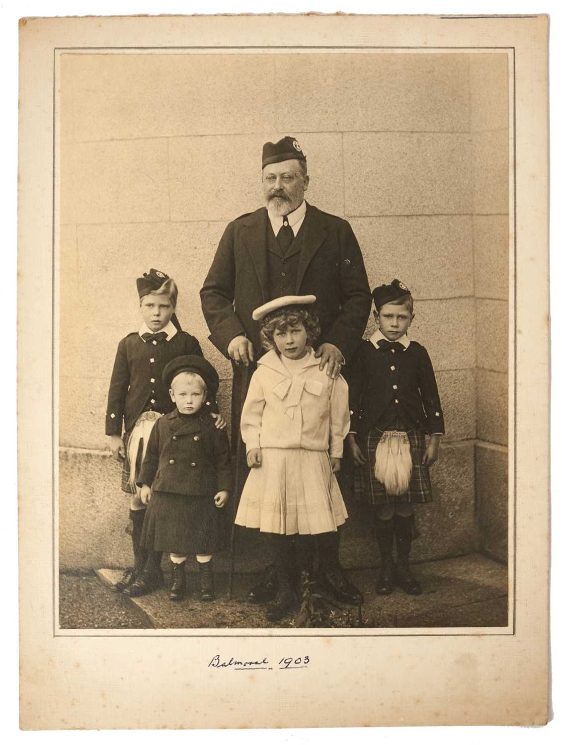 Lot 37 - H.M.King Edward VII, fine portrait photograph of The King at Balmoral 1903 with four of his grand children including the young King Edward VIII and King George VI, mounted on card 30.5 x 22.5 cm ov...