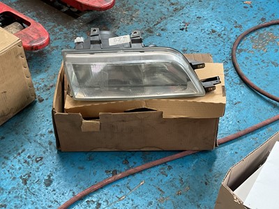 Lot 236 - New old stock Rover 200 headlight, part number XBC104640