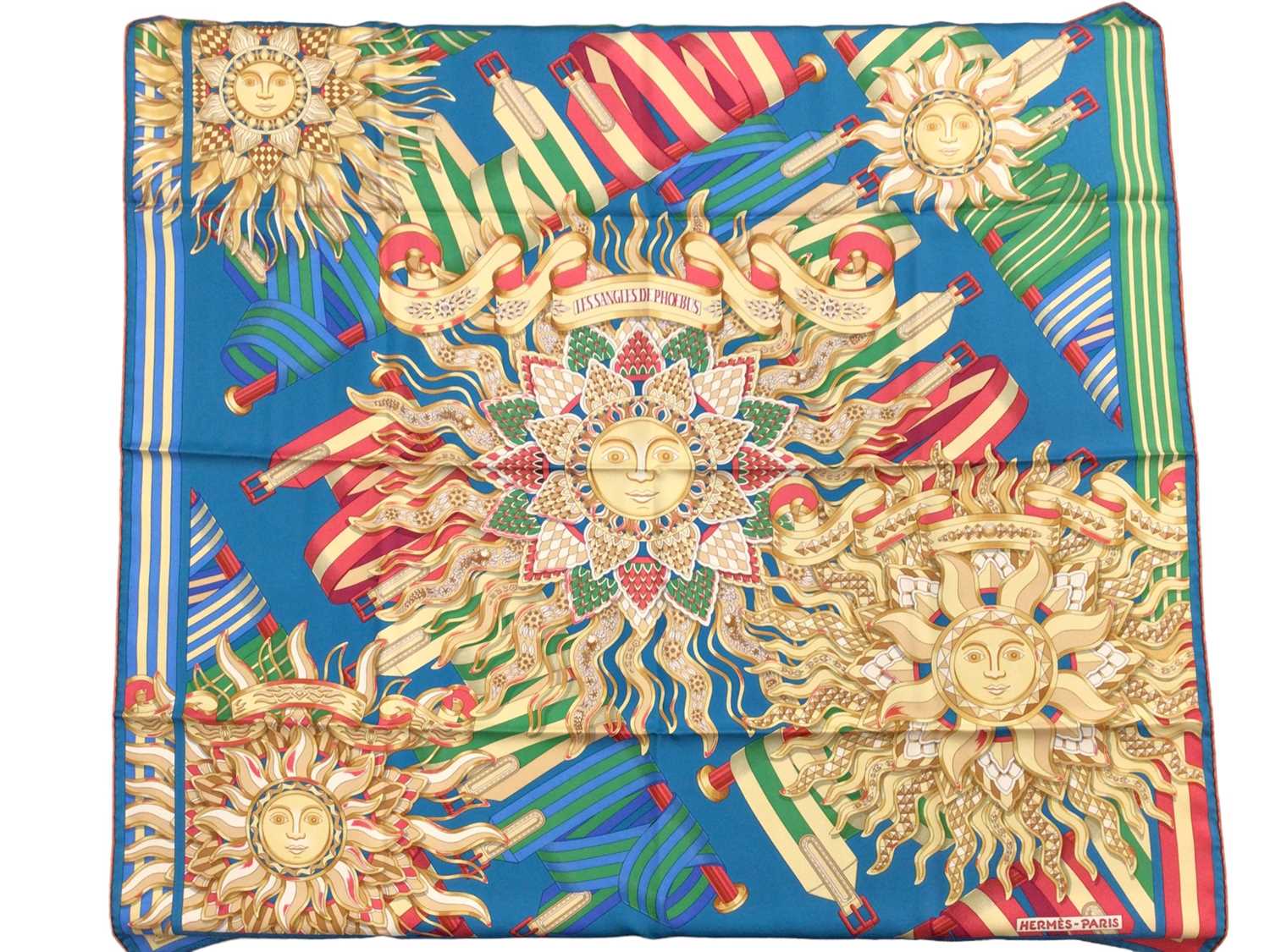 Lot 2153 - Hermès silk scarf Les Sangles De Phoebus designer J Metz, in orange Hèrmes box and with brown ribbon.