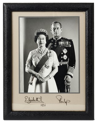 Lot 67 - H.M.Queen Elizabeth II and H.R.H. The Duke of Edinburgh, fine signed presentation portrait photograph of the Royal couple wearing Orders and decorations , signed in ink' Elizabeth R 1986 Philip' in...