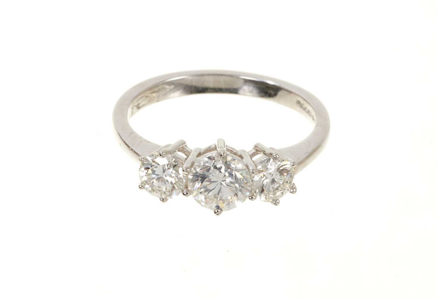 Lot 633 - Diamond three stone ring with three round brilliant cut diamonds in claw setting on 18ct white gold shank. Estimated total diamond weight approximately 2.01cts.