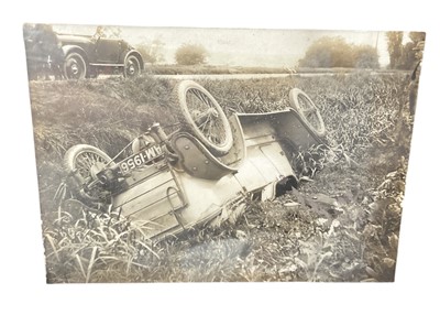 Lot 19 - Early motoring interest - 1920's photographs, newspaper cutting and related ephemera relating to a car crash, mounted in a glazed frame.