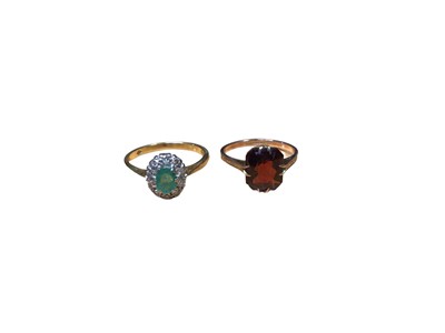 Lot 110 - Emerald and diamond cluster ring in 18ct gold setting together with a 1930s 9ct gold garnet ring (2)