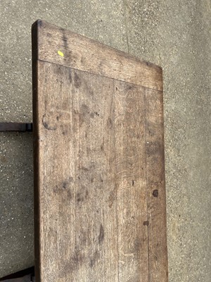 Lot 18 - Early 20th century oak refectory table, with plank top on trestle ends, 163 x 79cm