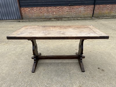Lot 18 - Early 20th century oak refectory table, with plank top on trestle ends, 163 x 79cm