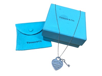 Lot 188 - Tiffany & Co silver 'Return to Tiffany' heart tag with key pendant on chain, with pouch and box