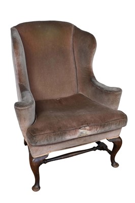 Lot 1490 - 18th century style walnut wing armchair, on cabriole legs and pad feet