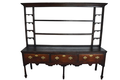 Lot 1099 - George III oak high dresser