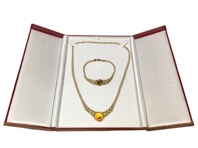 Lot 147 - Yellow metal (stamped 14k) amber pendant rope twist necklace and bracelet set