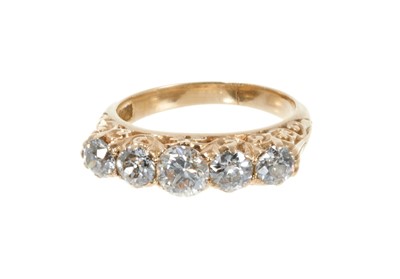 Lot 122 - Late Victorian 18ct gold diamond five stone ring in carved scroll setting