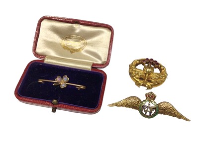 Lot 125 - 9ct gold and enamel RAF wings sweetheart brooch, Edwardian yellow metal opal three leaf clover bar brooch and one other antique yellow metal garnet brooch