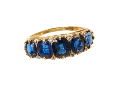 Lot 604 - Antique sapphire five stone ring with five graduated oval mixed cut blue 
sapphires
