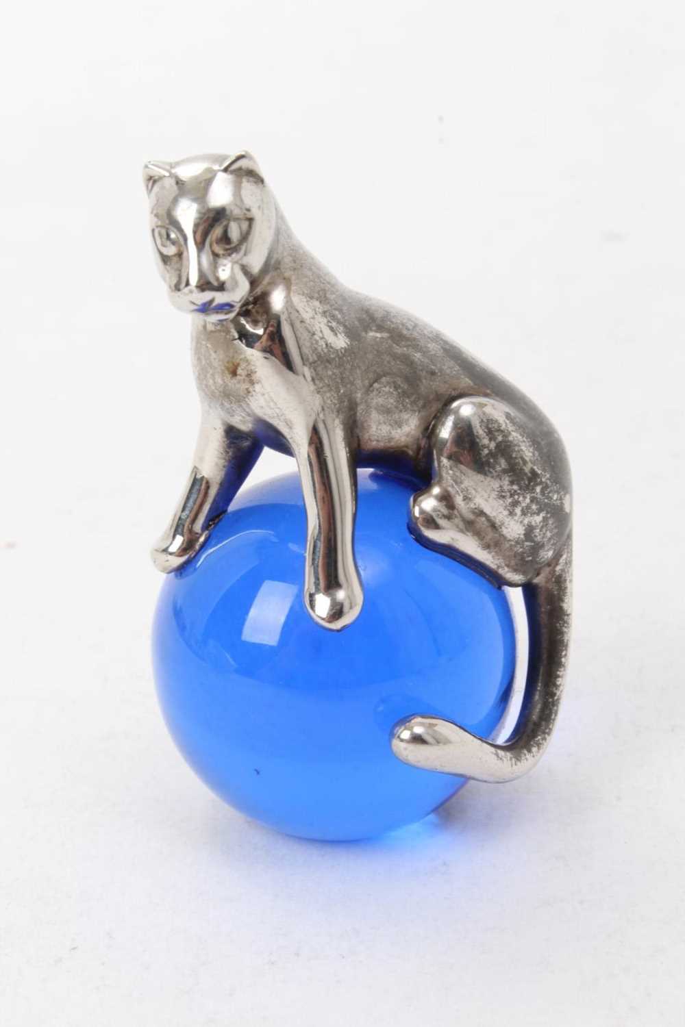 Lot 573 - Cartier silver and blue glass paperweight with Panther on a glass ball, 5.5cm