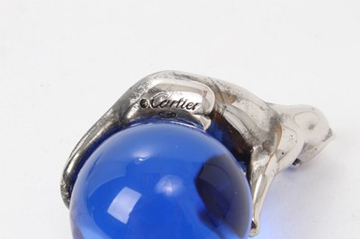 Lot 573 - Cartier silver and blue glass paperweight with Panther on a glass ball, 5.5cm