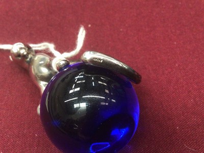 Lot 573 - Cartier silver and blue glass paperweight with Panther on a glass ball, 5.5cm