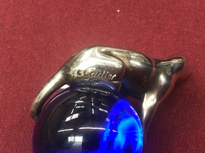 Lot 573 - Cartier silver and blue glass paperweight with Panther on a glass ball, 5.5cm