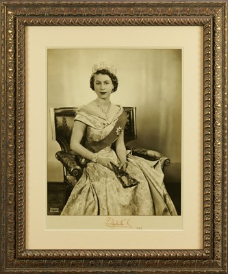 Lot 84 - H.M.Queen Elizabeth II, fine and large signed presentation Coronation year 1953 portrait photograph by Dorothy Wilding, the youthful Queen wearing the Order of The Garter, signed in ink ' Elizabeth...