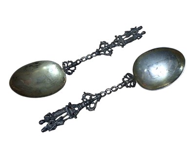 Lot 229 - Pair of continental silver serving spoons with figure decoration