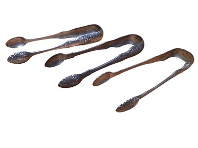 Lot 231 - Three pairs of Victorian silver sugar tongs