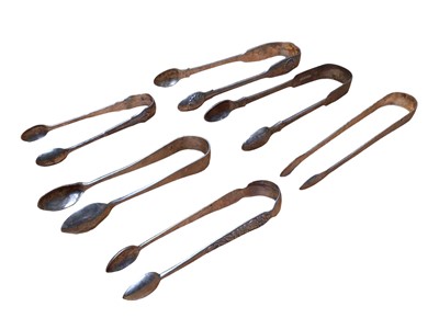 Lot 233 - Six pairs of silver and white metal sugar tongs