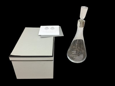 Lot 129 - H.M.Queen Elizabeth II, 2009 Royal Household Christmas present of a glass decanter with stopper with plated collar and  etched Royal cipher in original box with Royal cipher to lid and presentation...