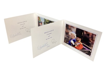 Lot 160 - H.M.Queen Elizabeth II and H.R.H. The Duke of Edinburgh, two signed 2003 and 2004 Christmas cards with twin gilt ciphers to cover, colour photograph of the Royal couple to interiors.
