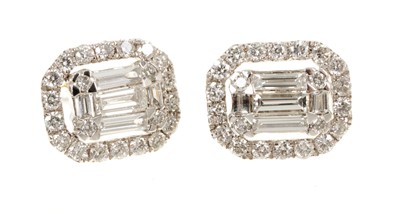 Lot 631 - Pair of diamond cluster earrings, the octagonal cluster with baguette cut and brilliant cut diamonds in 18ct white gold setting. Estimated total diamond weight approximately 1ct.