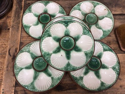 Lot 15 - Set of six French majolica oyster plates with basket weave moulding, painted green and brown, 24cm diameter