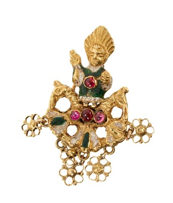 Lot 734 - Gold and enamel brooch depicting a figure flanked by two horse heads, enamel decoration with cabochons and suspending five pierced gold rosettes, 40mm.