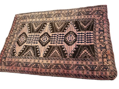Lot 1595 - Baluch rug, with conjoined medallions on biscuit ground, 180 x 118cm
