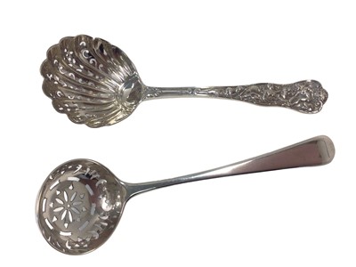Lot 208 - Rare Bacchanalian pattern silver sifter ladle and a Georgian silver sifter ladle (2)