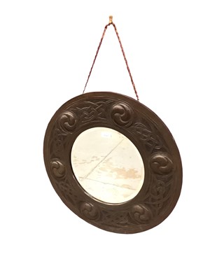 Lot 1137 - Arts and Crafts circular wall mirror in embossed copper frame