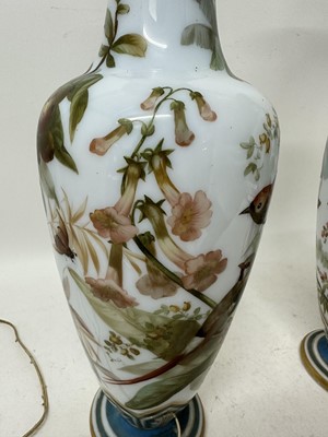 Lot 1058 - Pair of 19th century painted bohemian milk glass vases, presented as lamps, painted with exotic birds. vases 50cm high