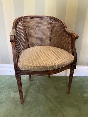 Lot 1074 - Early 20th century caned beech bergère chair, of tub form, raised on stop-fluted tapered legs