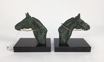 Lot 782 - M Leducq pair of spelter horse head and neck bookends on rectangular black marble bases, signed, 13cm high x13cm wide