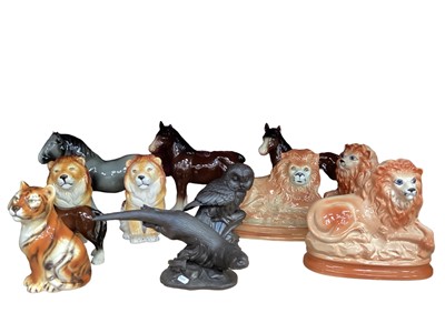 Lot 623 - Collection of large animal ornaments including Lions, Horses, Owls, Coopercraft Ram and Sheep etc - 2 shelves